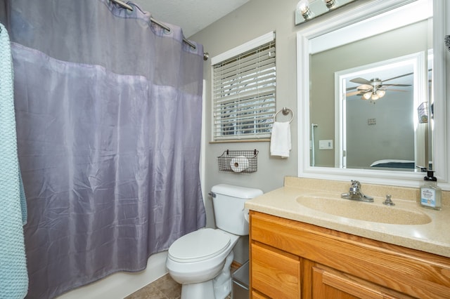 full bathroom with ceiling fan, tile patterned floors, shower / bath combination with curtain, toilet, and vanity