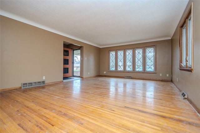 empty room with light wood-type flooring