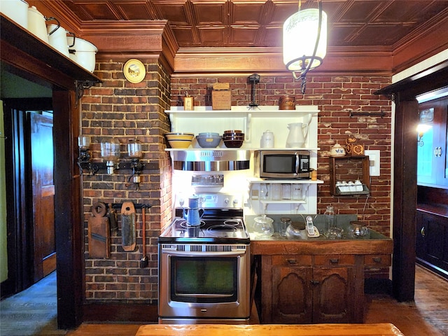 kitchen featuring crown molding, wood-type flooring, stainless steel appliances, and brick wall