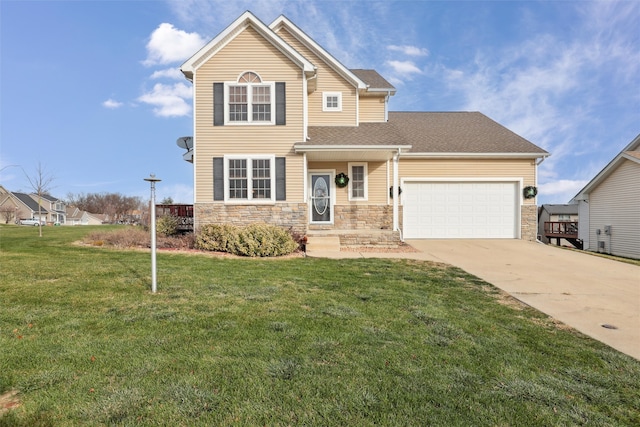 view of front of property featuring a front yard and a garage