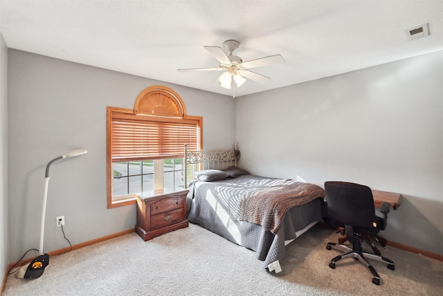 bedroom with ceiling fan and light colored carpet