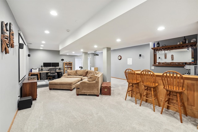 living room featuring light carpet and bar area