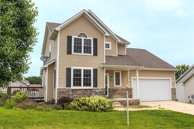 201 Elm Ave, Norwalk, IA 50211 - traditional-style home featuring concrete driveway, an attached garage, and a front lawn