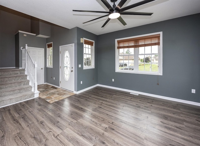 201 Elm Ave, Norwalk, IA 50211 - foyer entrance featuring a ceiling fan, wood finished floors, and stairway