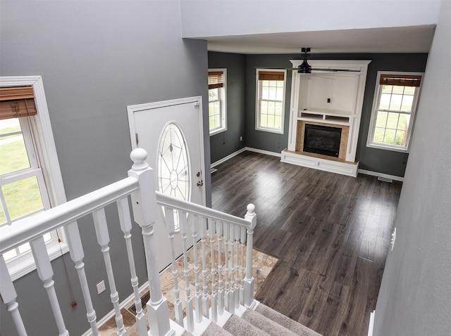 201 Elm Ave, Norwalk, IA 50211 - stairway with healthy amount of natural light, a ceiling fan, and wood finished floors