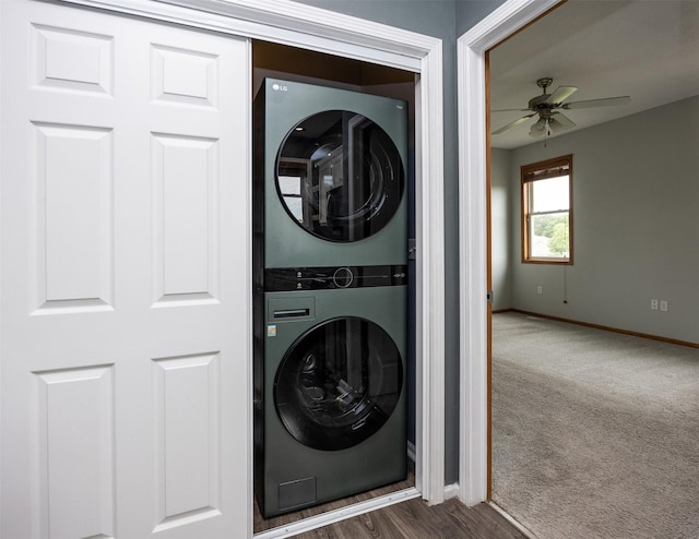 201 Elm Ave, Norwalk, IA 50211 - laundry room with stacked washer and clothes dryer, ceiling fan, and dark carpet