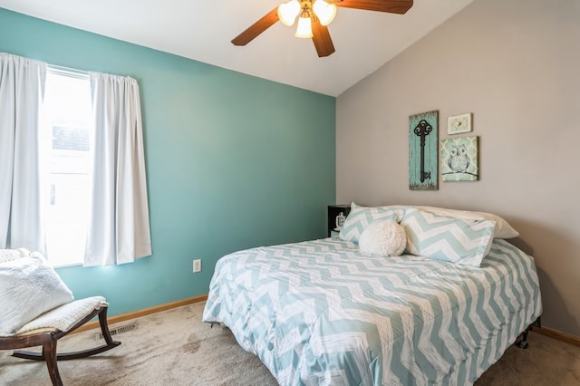 bedroom with carpet, ceiling fan, and lofted ceiling