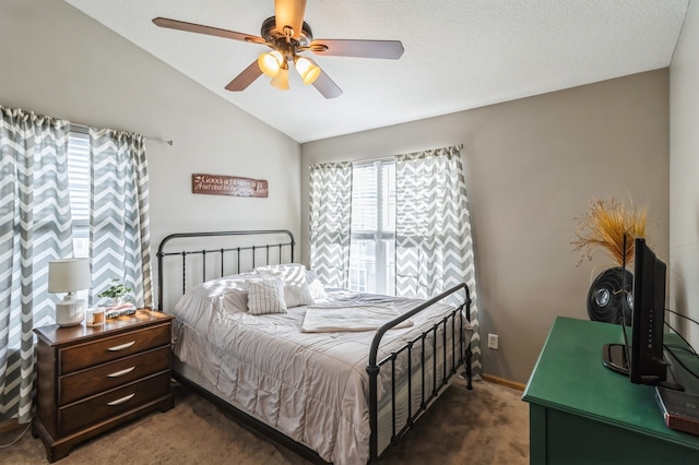 bedroom with dark colored carpet, a textured ceiling, ceiling fan, and lofted ceiling