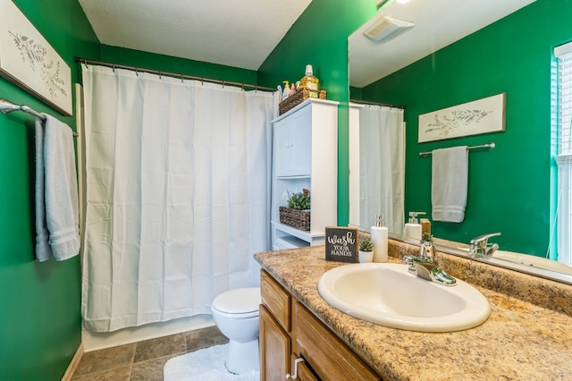 bathroom featuring a shower with shower curtain, vanity, and toilet