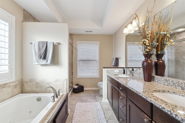 bathroom with vanity, a bathtub, tile patterned flooring, toilet, and a tray ceiling