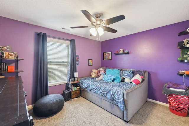 carpeted bedroom featuring ceiling fan