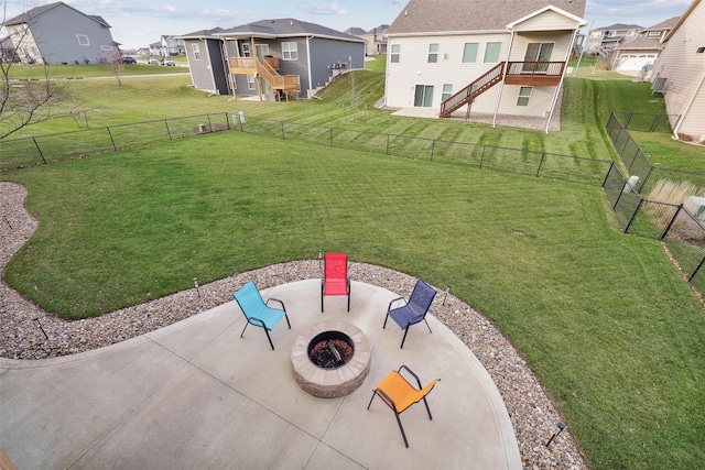 view of yard featuring a fire pit, a patio area, and a deck