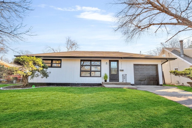 view of front of home with a front lawn and a garage