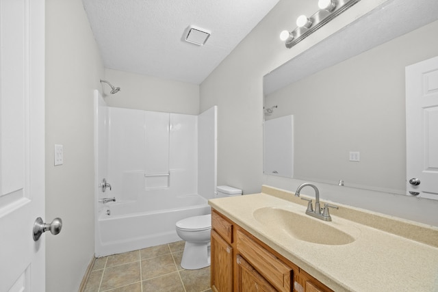 full bathroom featuring a textured ceiling, shower / tub combination, toilet, vanity, and tile patterned floors