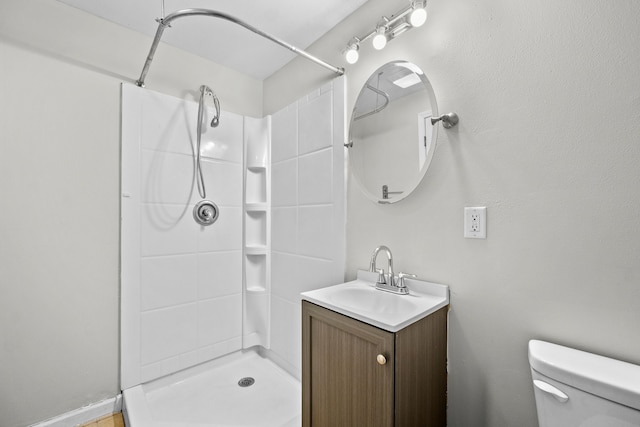 full bathroom with toilet, a shower, and vanity