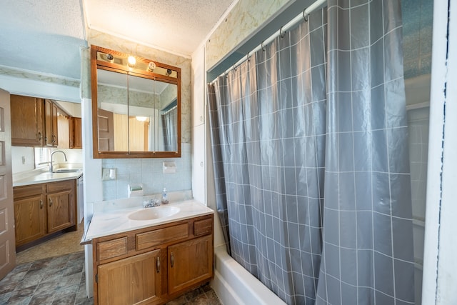 bathroom featuring vanity, ornamental molding, a textured ceiling, and shower / bath combo