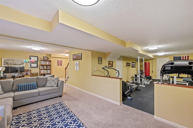 living room with a textured ceiling and carpet