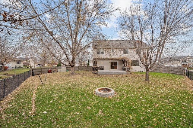 view of yard with a fire pit and a wooden deck