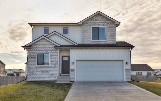 view of front facade featuring a yard and a garage