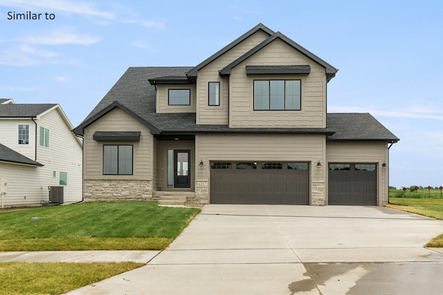 craftsman-style home with cooling unit, a front yard, and a garage