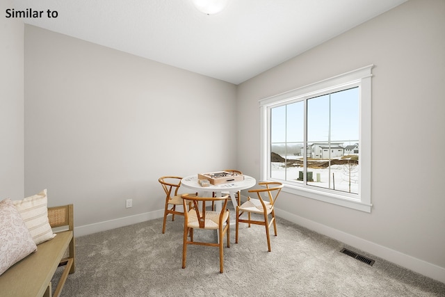 dining room with carpet floors