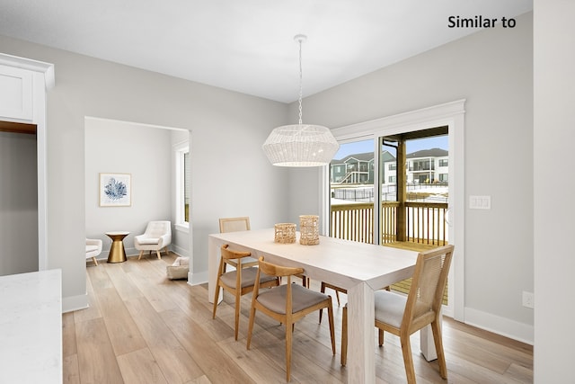 dining area featuring light wood-type flooring