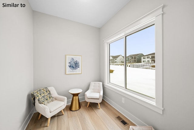 sitting room with hardwood / wood-style floors