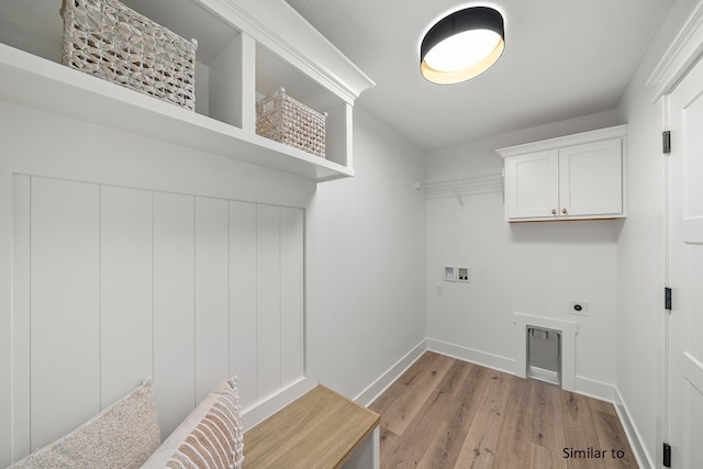 laundry area with electric dryer hookup, light hardwood / wood-style floors, and hookup for a washing machine