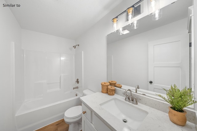 full bathroom with toilet, vanity, shower / bathtub combination, and hardwood / wood-style flooring