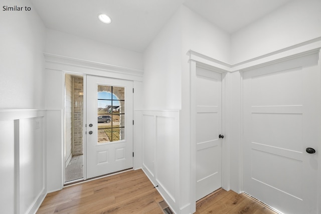 doorway featuring wood-type flooring