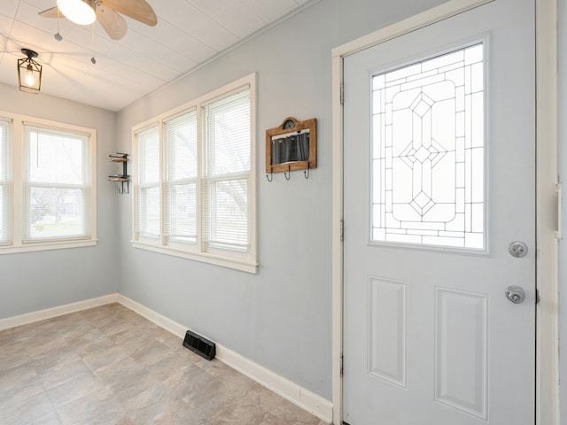 entrance foyer with ceiling fan