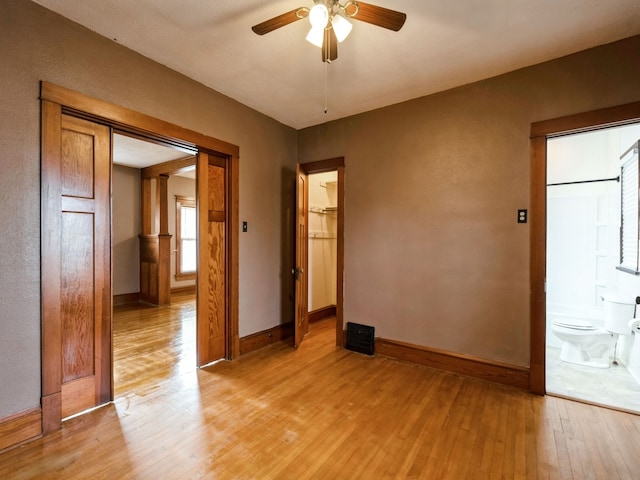 empty room featuring ceiling fan and light hardwood / wood-style floors