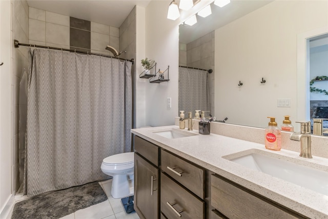 bathroom with a shower with curtain, tile patterned floors, vanity, and toilet