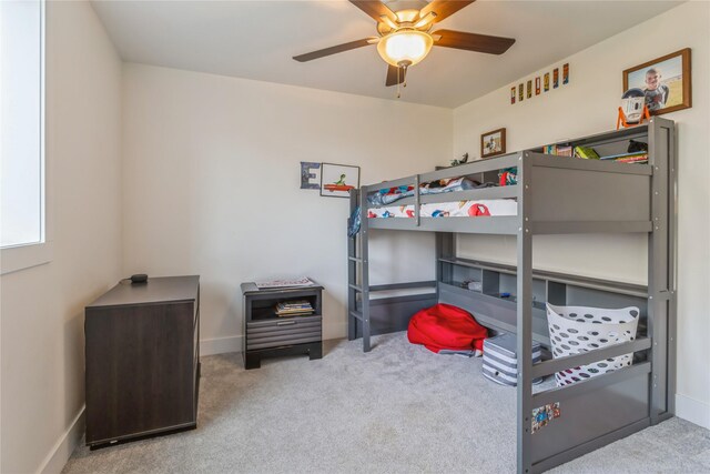 bedroom featuring ceiling fan and light colored carpet