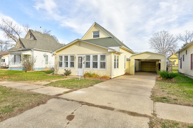 view of front of home featuring an outbuilding and a carport