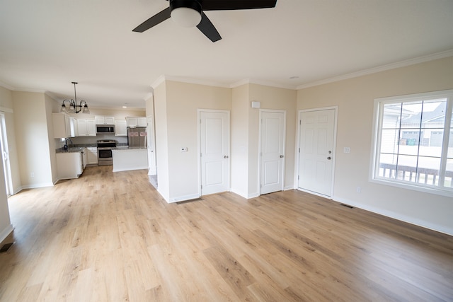 unfurnished living room with crown molding, sink, ceiling fan with notable chandelier, and light wood-type flooring