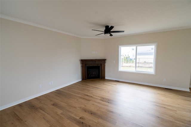 unfurnished living room with ceiling fan, light hardwood / wood-style flooring, and ornamental molding