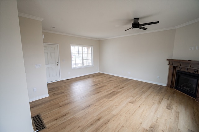 unfurnished living room with light hardwood / wood-style floors, ceiling fan, and crown molding