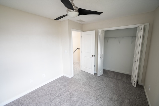 unfurnished bedroom featuring ceiling fan, carpet floors, and a closet