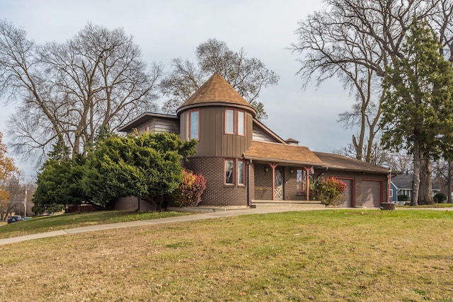 victorian house featuring a garage and a front lawn