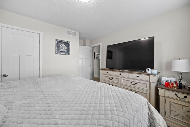 bedroom featuring a textured ceiling