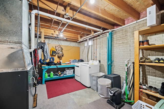 basement featuring independent washer and dryer and heating unit