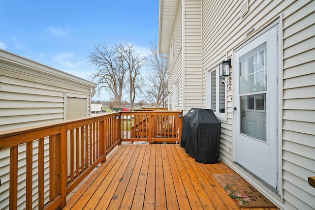 wooden deck with area for grilling