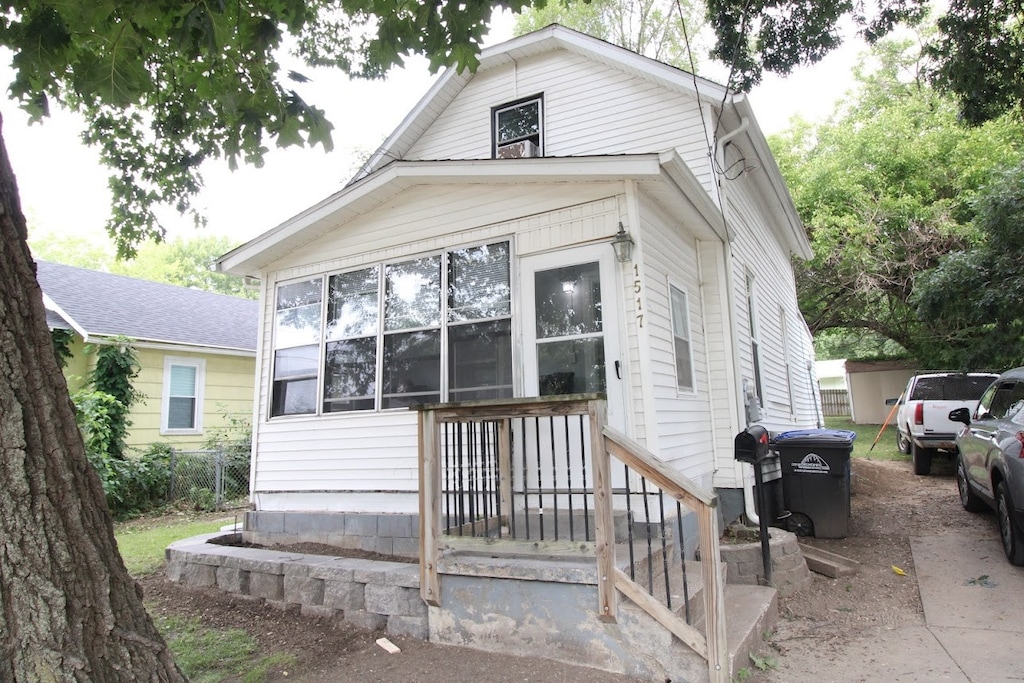 view of front of property with a sunroom