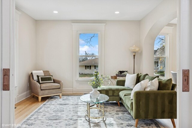 living area with hardwood / wood-style floors