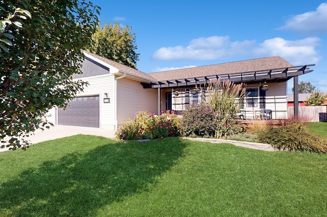 single story home with a front yard and a garage