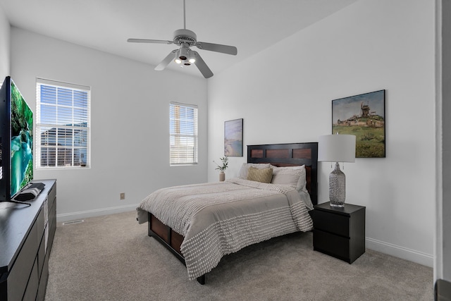 bedroom featuring ceiling fan and light colored carpet