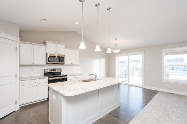 kitchen with stainless steel appliances, sink, dark hardwood / wood-style floors, white cabinetry, and hanging light fixtures