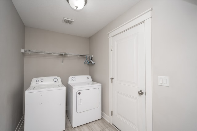 washroom featuring washing machine and dryer