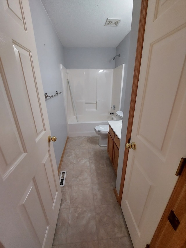 full bathroom with vanity, tile patterned flooring, toilet, a textured ceiling, and shower / bath combination